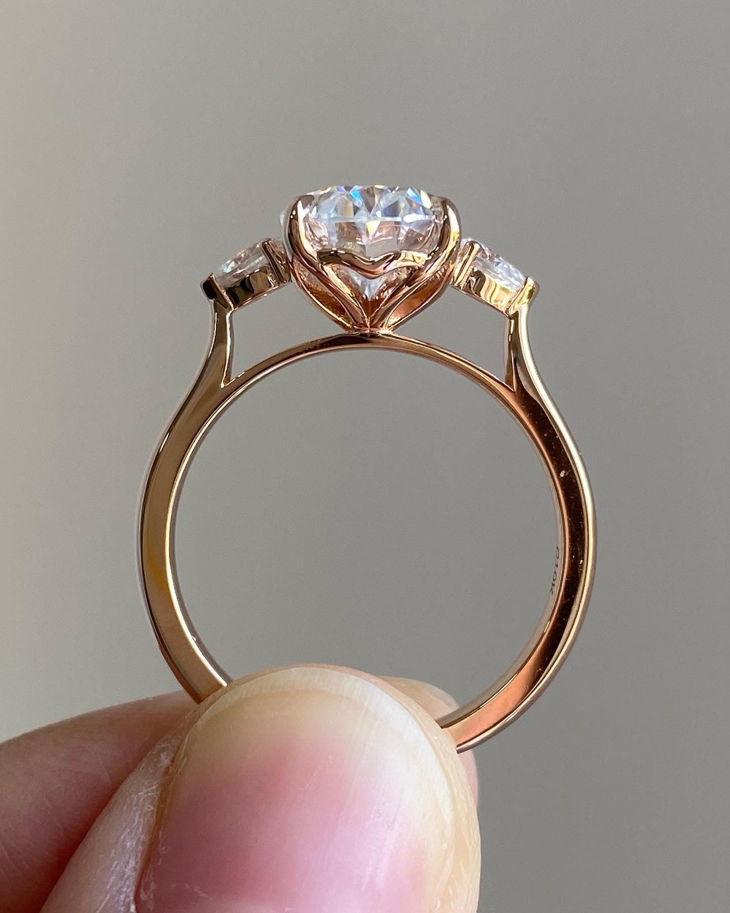 Oval Moissanite Engagement Ring: Three Stone Pear Side Stones, 2 Carat