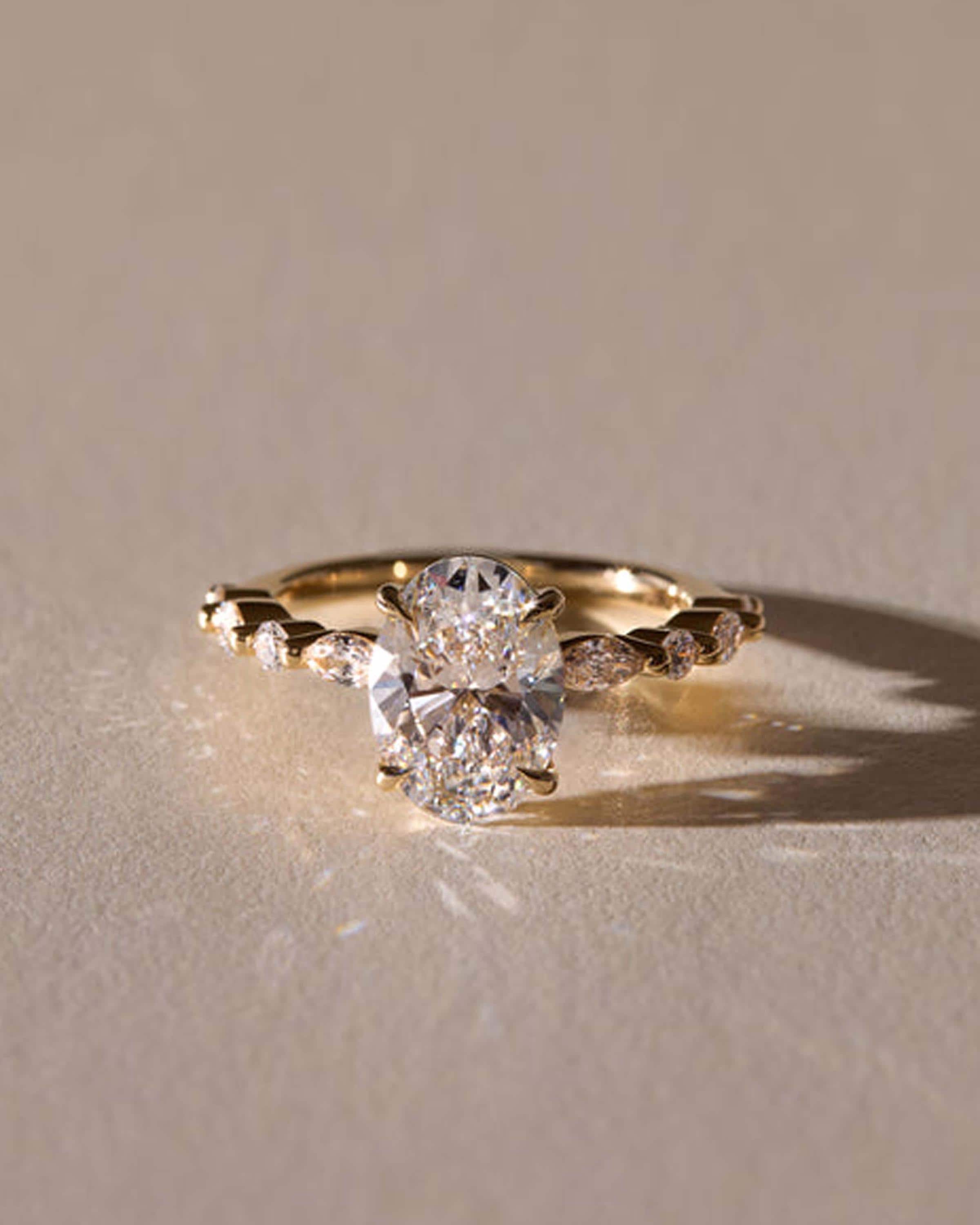 Oval Lab Grown Diamond Engagement Ring: Marquise & Round Side Stones