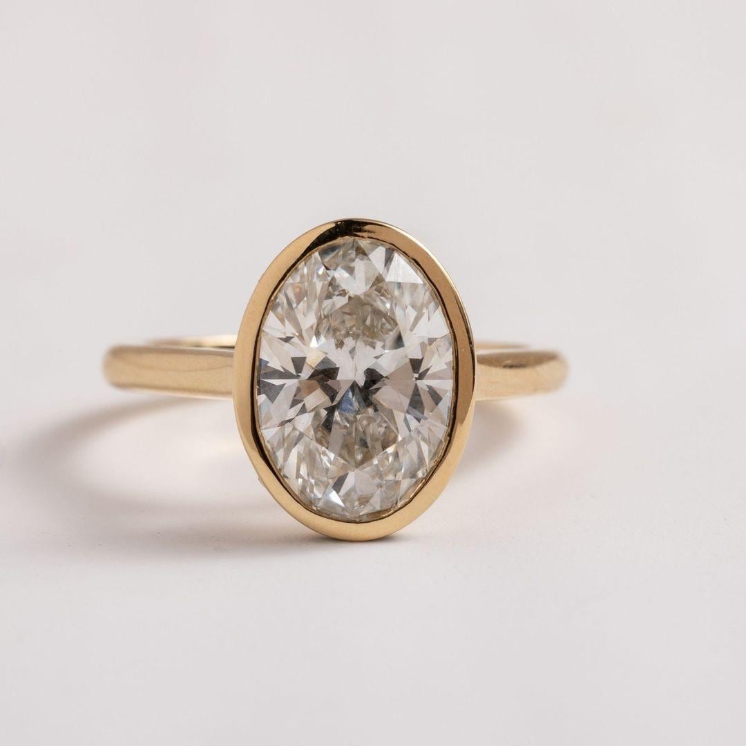 2Ct IGI Certified Oval Lab Grown Diamond Ring: 14K Gold Bezel Setting