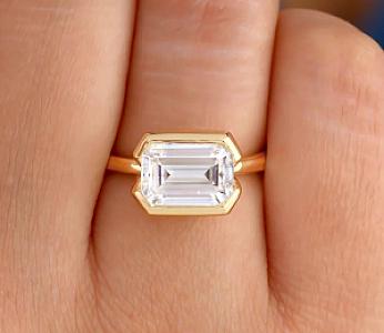 Emerald Cut Moissanite Engagement Ring: 14K Gold Half Bezel Solitaire - Image 1