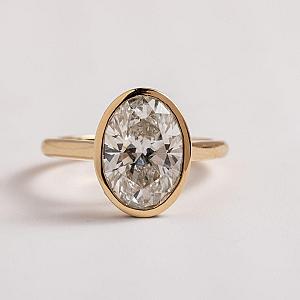 2Ct IGI Certified Oval Lab Grown Diamond Ring: 14K Gold Bezel Setting - Image 1
