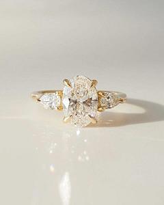 Oval Lab Grown Diamond Three Stone Engagement Ring: 14k Gold, Pear Side Stones - Image 1