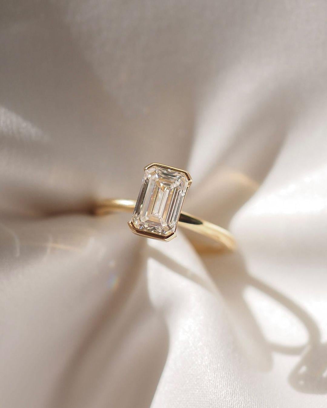 2.00CT Emerald Cut Lab Grown Diamond Ring: 14K Yellow Gold Half Bezel Set